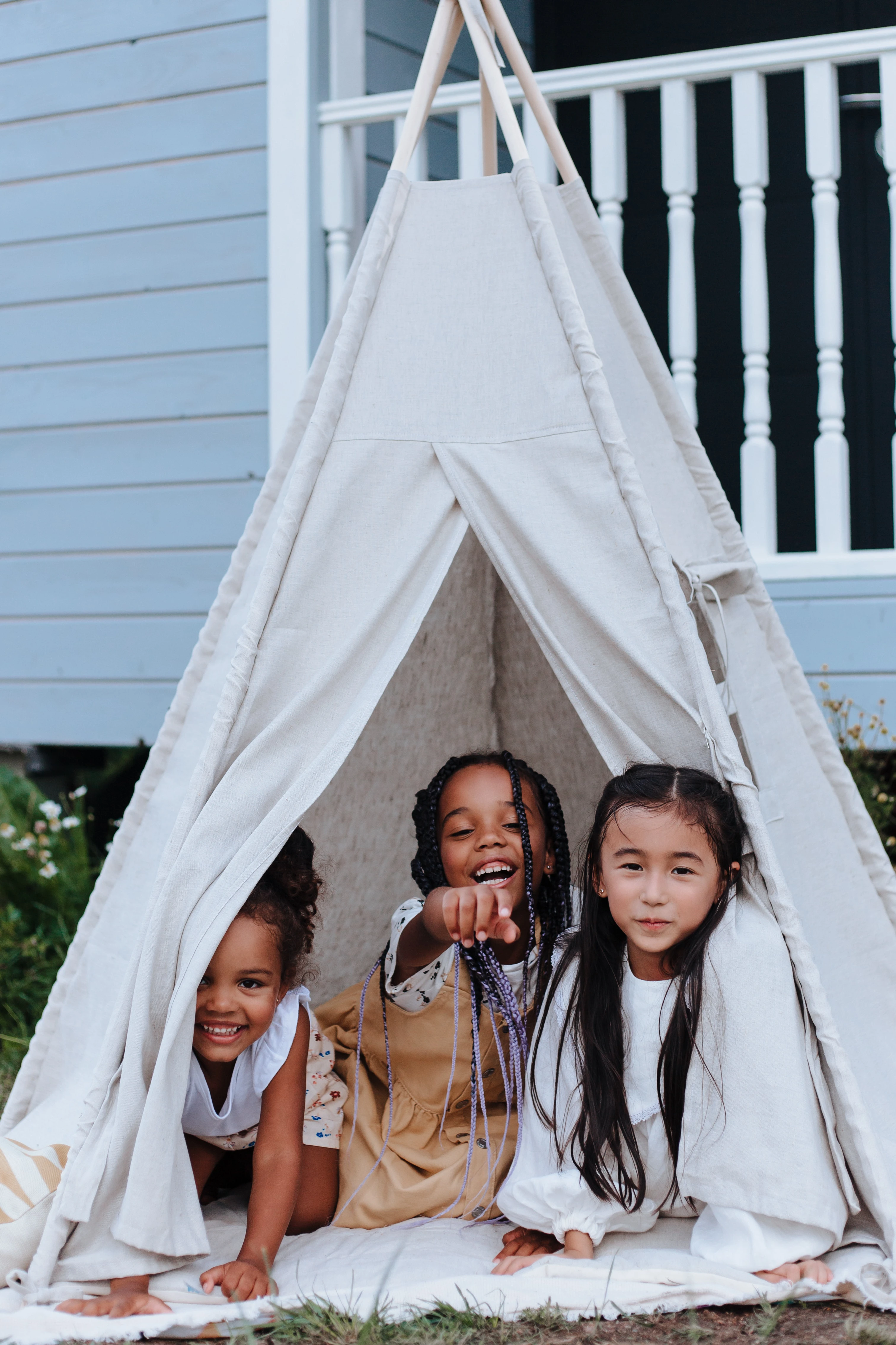 children in white tent in the garden