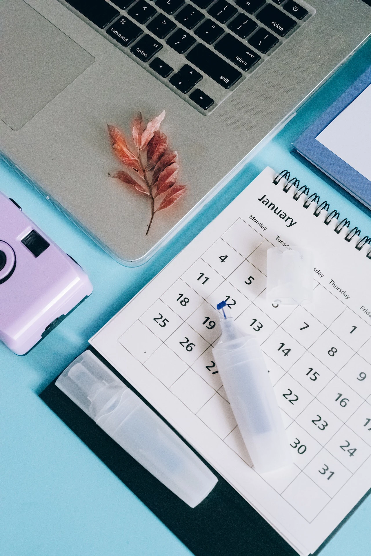 calendar, highlighter, and laptop