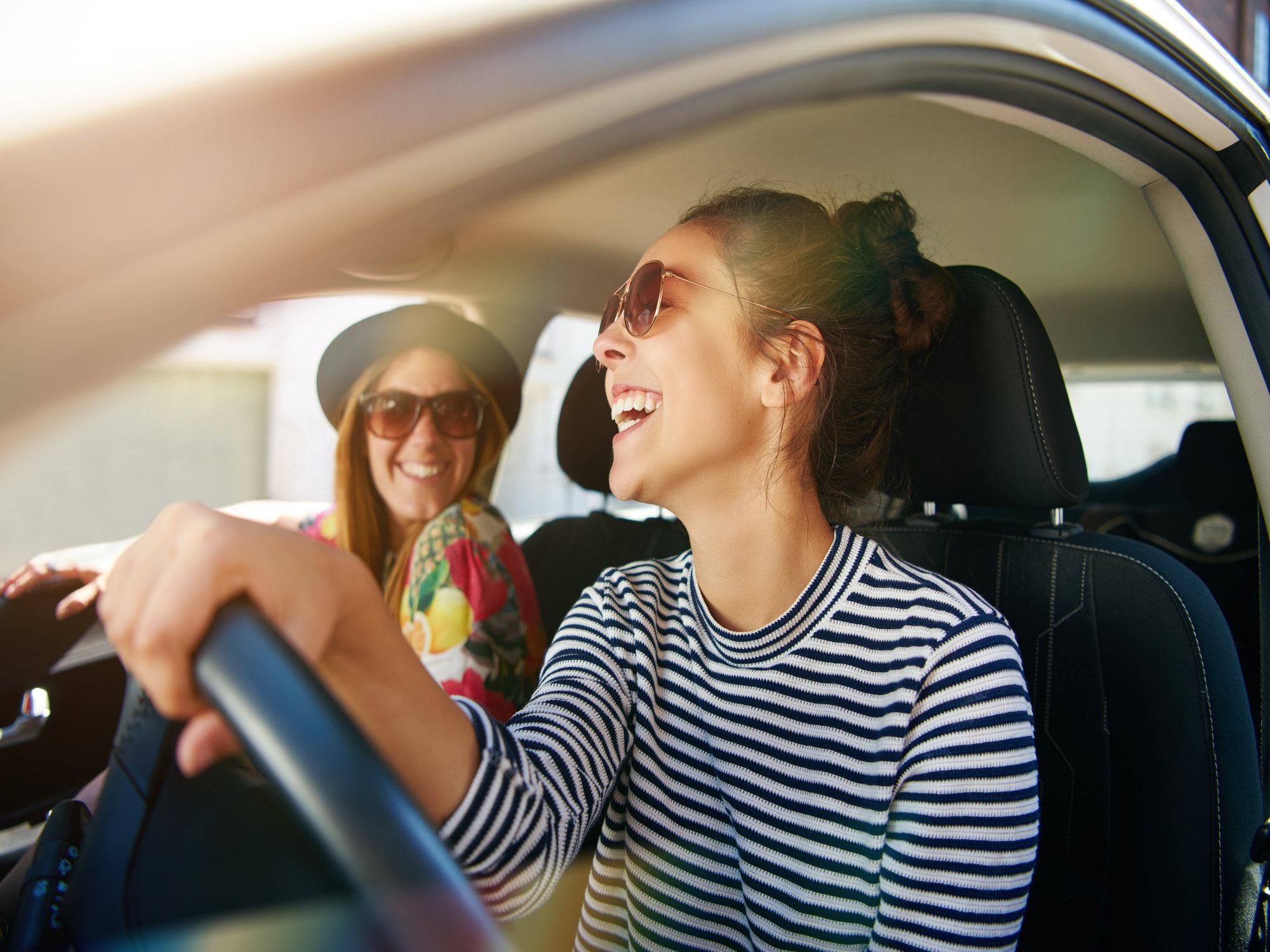 Friends laughing in a car