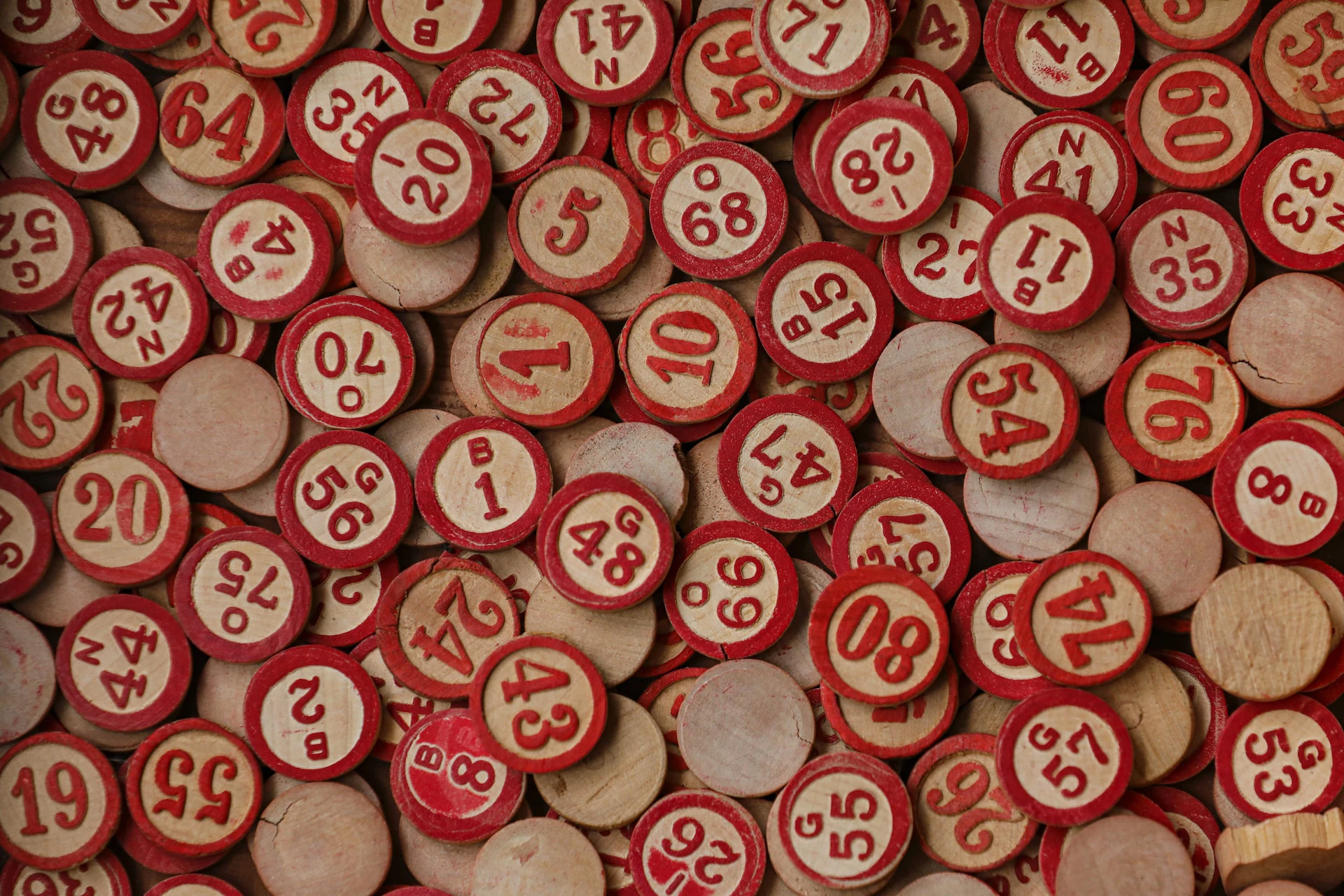 wooden red number disks in a flat pile
