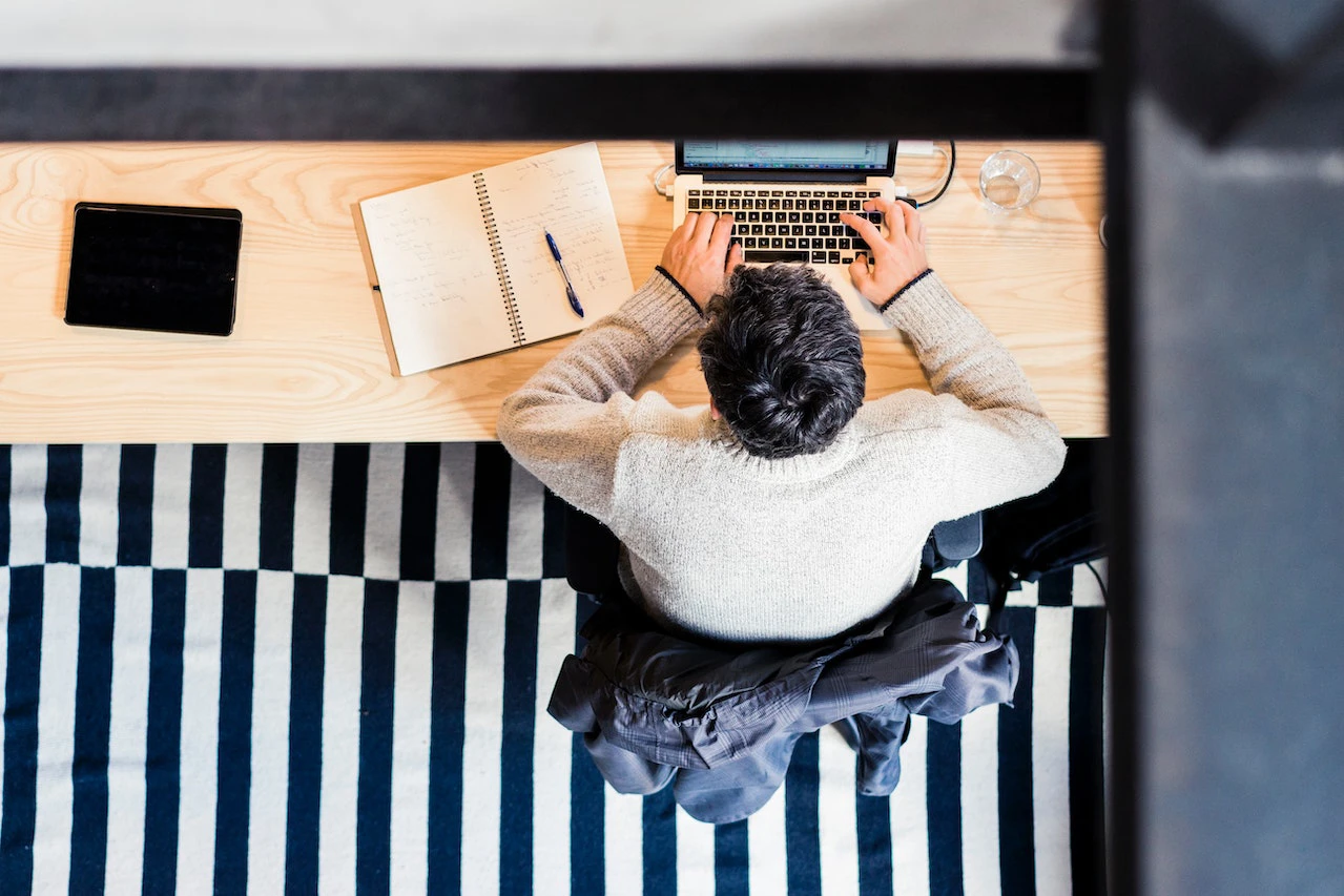 Aerial view of person using a laptop