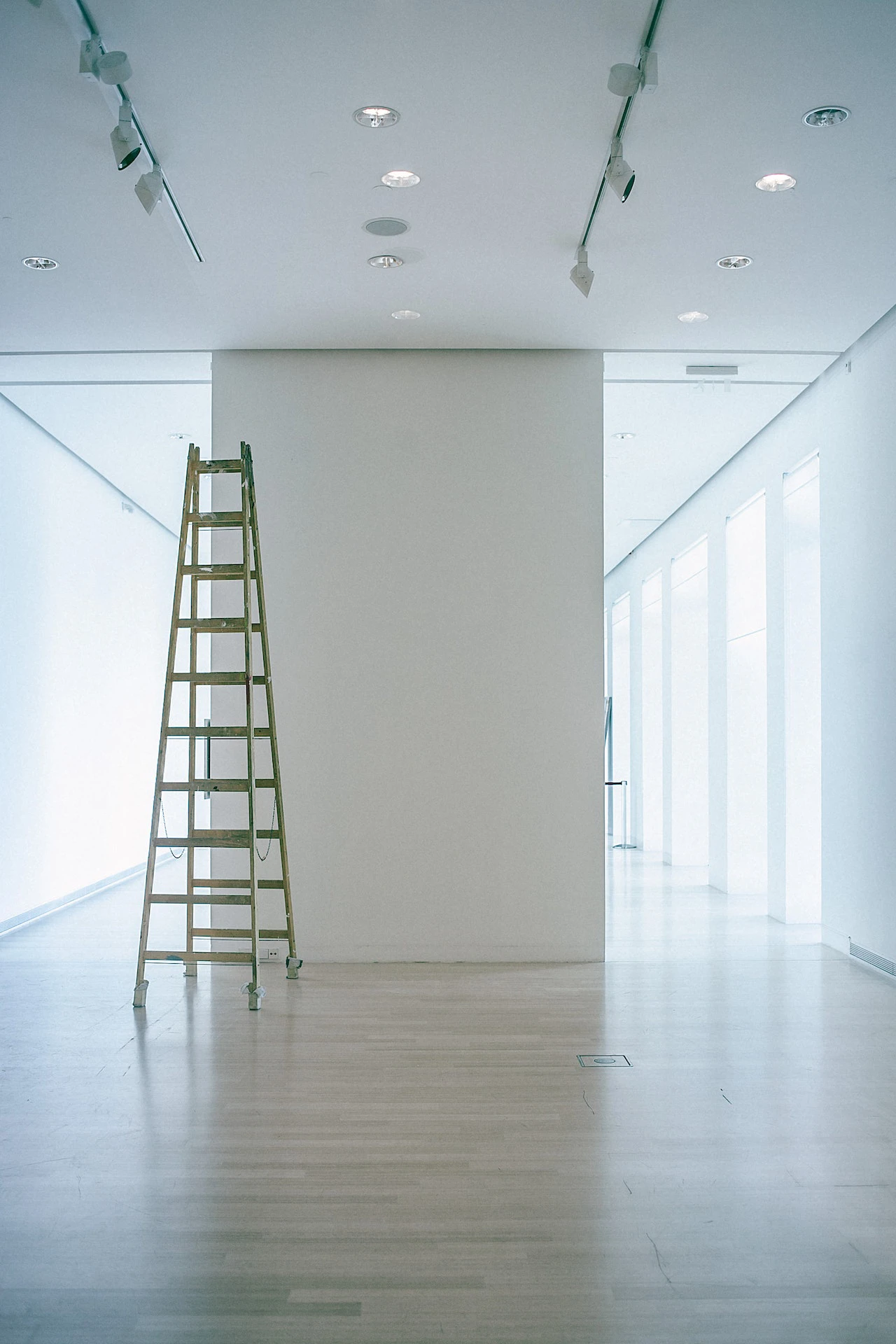 Image of a ladder in a room with all-white walls