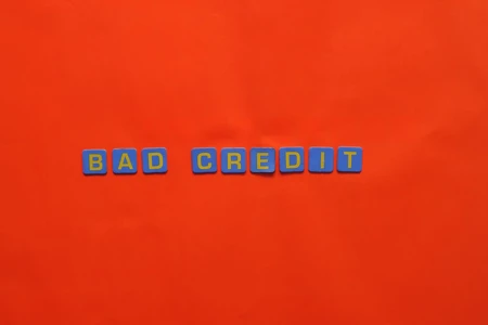 Red background with blue and yellow text that reads 'bad credit'