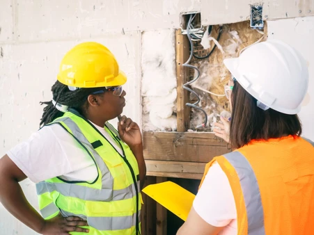 Engineer Looking at a Demolished Wall