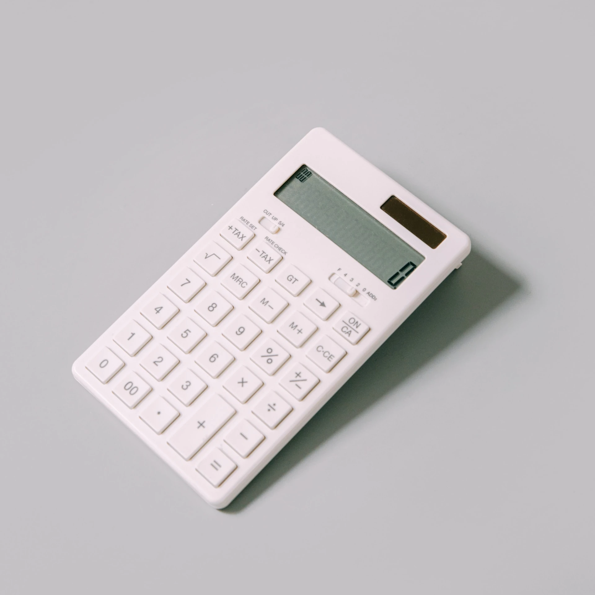 white calculator on grey background