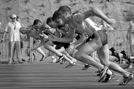 black and white image of people running a race