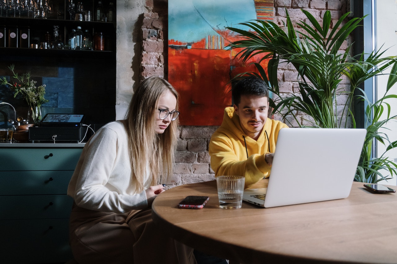 Couple looking at a laptop