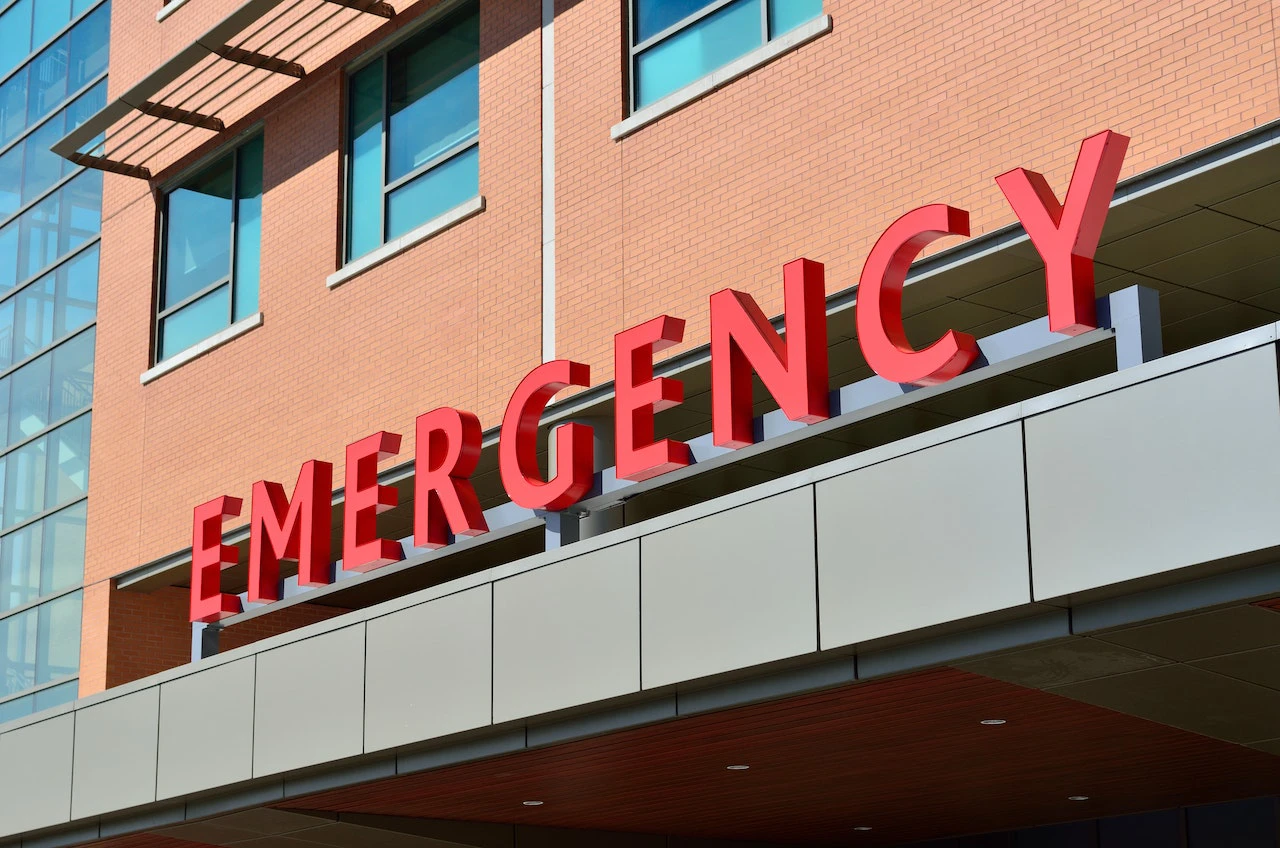 A sign that reads 'emergency' on the front of a building