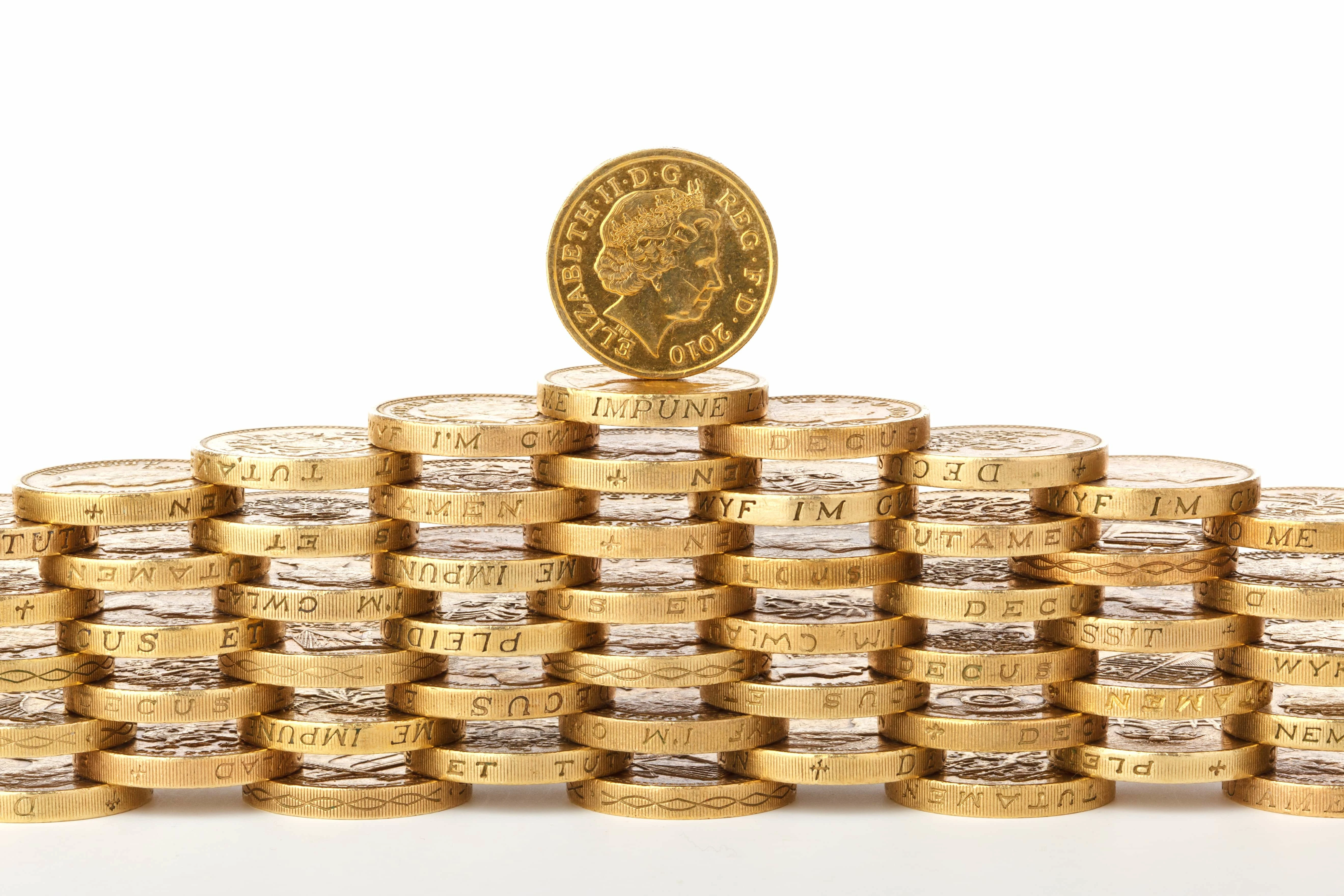 Pound coins stacked on top of each other